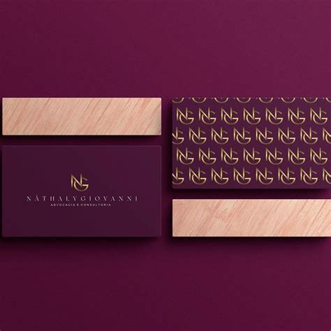 The Business Card Is Designed To Look Like Wood And Has Gold Foil