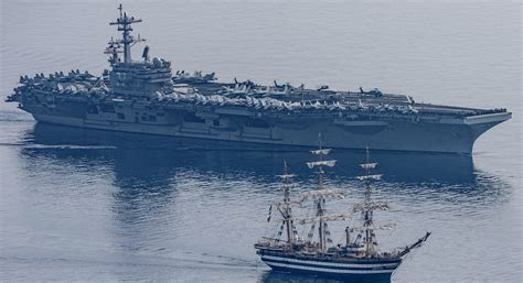 Amerigo Vespucci Ship Meets At Sea The American Aircraft Carrier USS