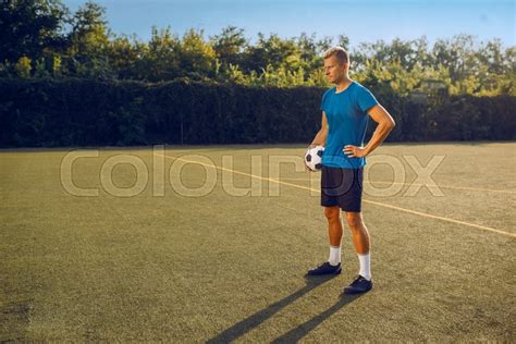 Male Soccer Player With Ball Standing Stock Image Colourbox