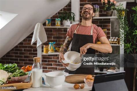 Young Man Cooking Dinner Photos And Premium High Res Pictures Getty