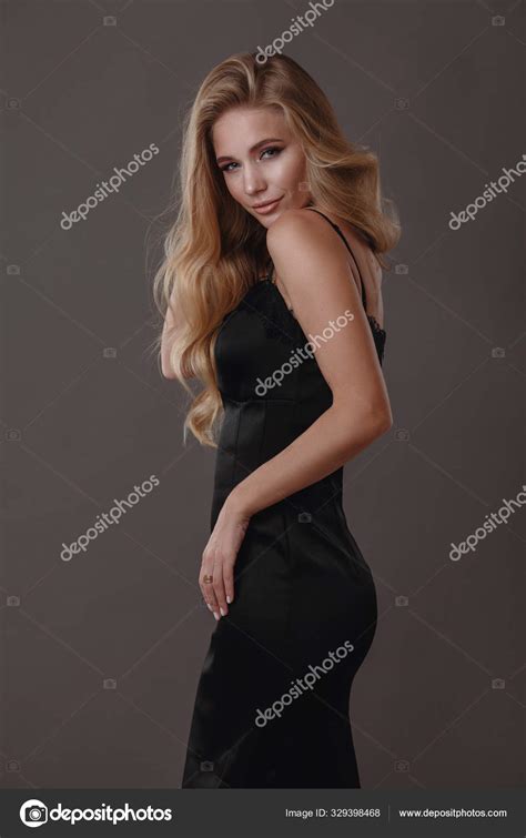 Beautiful Woman In Black Dress In Studio Stock Photo By ©selenittt