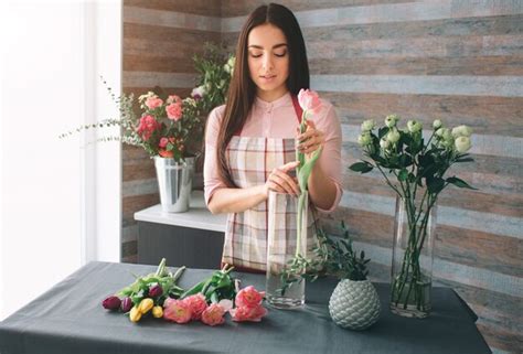 Premium Photo Female Florist At Work Pretty Young Dark Haired Woman