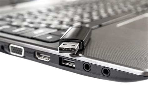 Premium Photo | USB flash drive on laptop Isolated on white