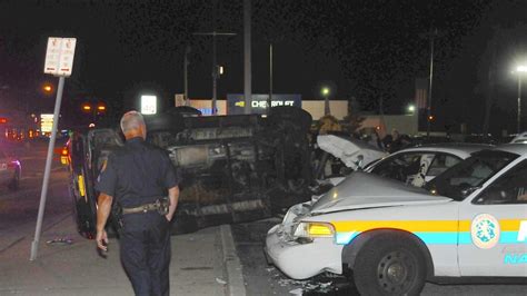 SUV rolls over parked Nassau police car - Newsday