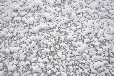 Premium AI Image | Graupel snow texture on the ground