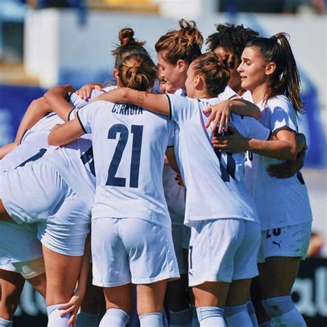 A Group Of Women S Soccer Players Huddle Together