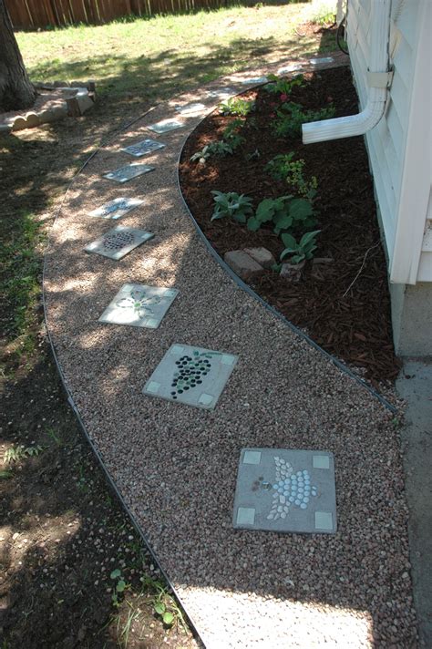 6 Bag Of Concrete And Glass Beads From The Dollar Store Made These Stepping Stones Garden