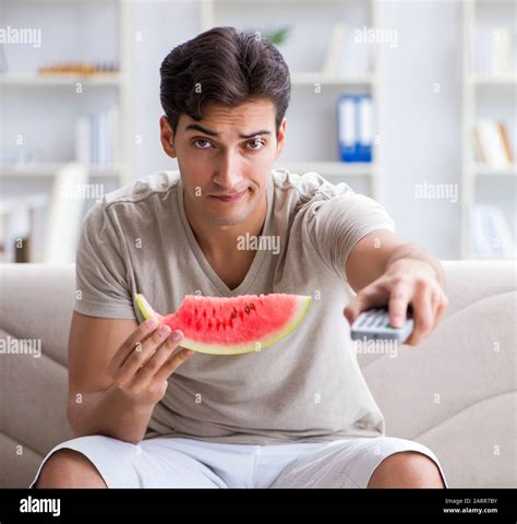 The Man Eating Watermelon At Home Stock Photo Alamy