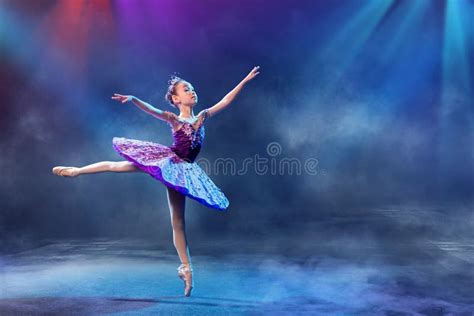 A Little Japanese Ballerina Dances On Stage In A Lilac Tutu On Pointe Shoes Classical Ballet