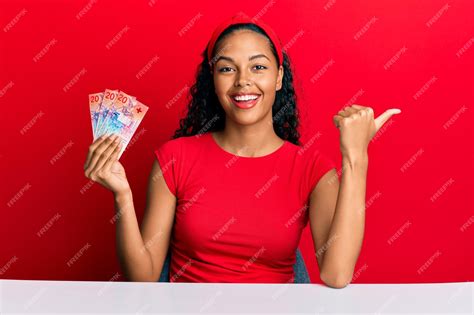 Free Photo Young African American Girl Holding Swiss Franc Banknotes