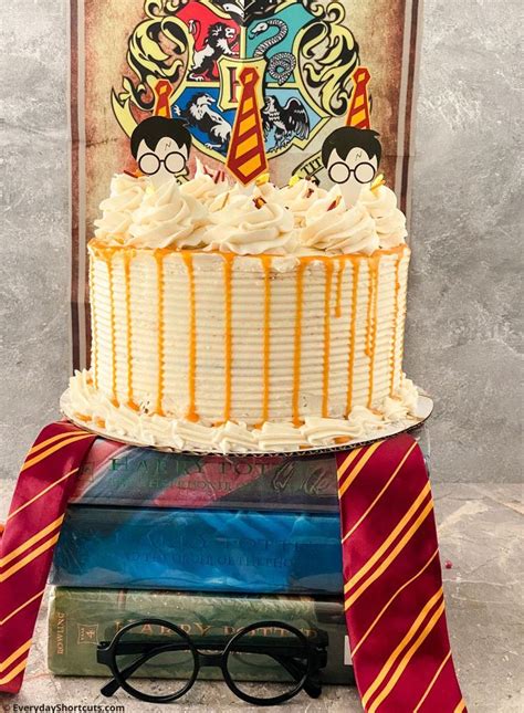 A Harry Potter Themed Birthday Cake With Glasses And Tie Around It On