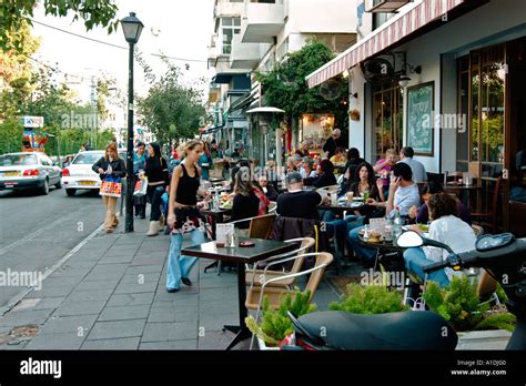 Israel Tel Aviv Drinking Coffee And Relaxing In An Open Air Cafe In