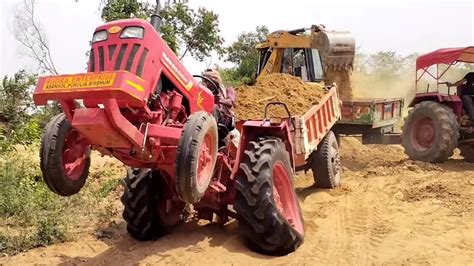 New Jcb Dx Machine Loading Mud In Mahindra Tractor And Di