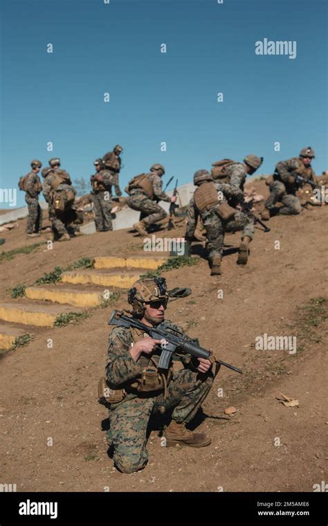 A Us Marine With The Advanced Machine Gun Course Sets Security During