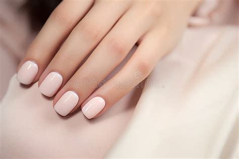 Glamour Woman Hand With Nail Polish On Her Fingernails Nude Shade Nail Manicure With Gel Polish