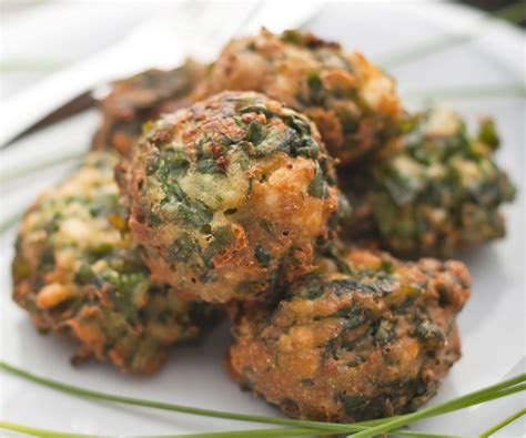 These savory fried spinach balls come together easily, and they make a great little appetizer or ...