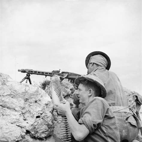 Filemen Of The 2nd Sherwood Foresters Firing A Captured German Mg42