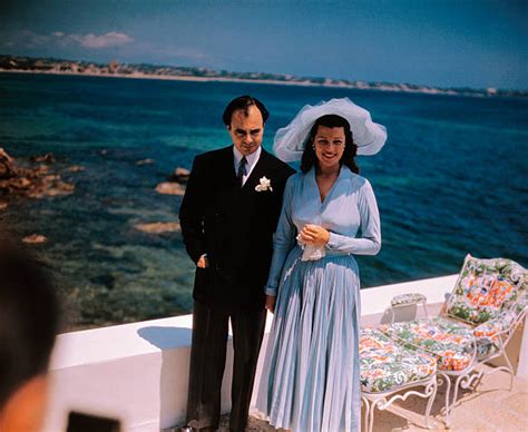 Rita Hayworth and Prince Aly Khan Standing on Yacht Pictures | Getty Images