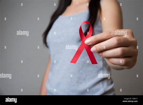 Closeup Woman Hand Holding Red Ribbon Hiv World Aids Day Awareness