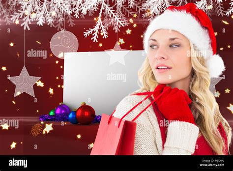 Composite Image Of Happy Festive Blonde With Shopping Bag Stock Photo