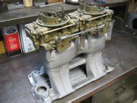 SBC Edelbrock Tunnel Ram W Two Holley 660 Center Squirter Carbs The