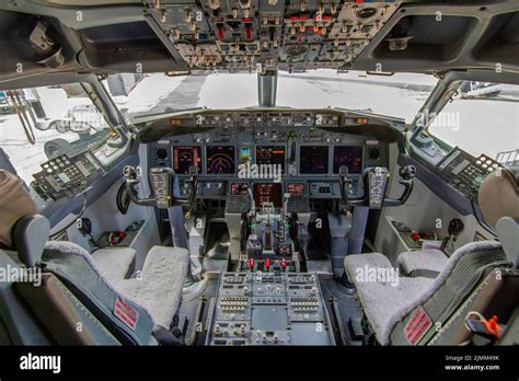 A view of the cockpit of a large commercial airplane a cockpit ...