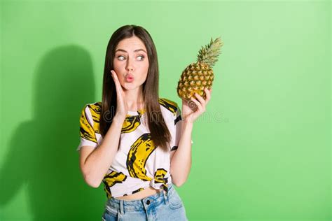 Photo Of Happy Nice Young Woman Hold Hand Pineapple Cheekbone Send Air