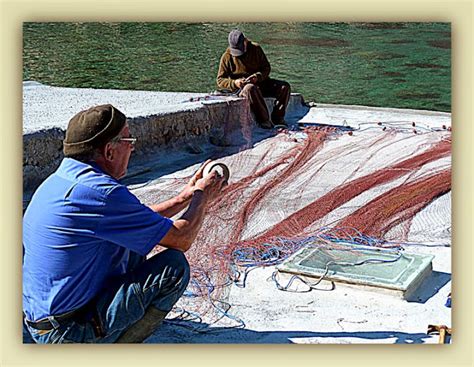 Just An Image Fishermen Mending The Fishing Nets