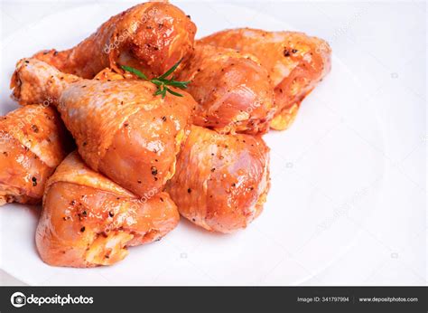 Chicken Legs In A Red Marinade On A White Plate Top View Chicken Meat