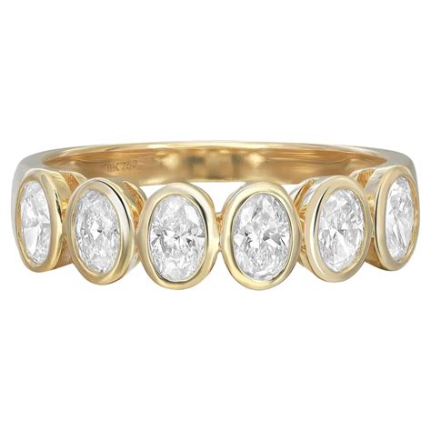 Customizable 086 Carat Oval Diamond Bezel Set Eternity Band Ring 18k