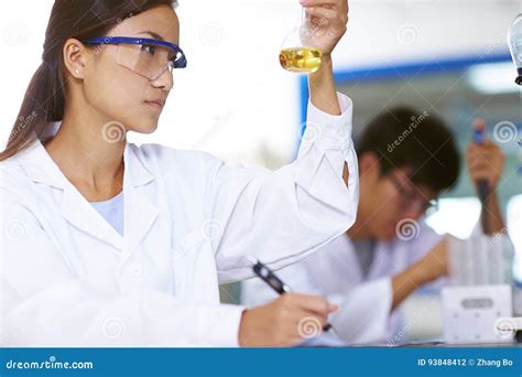 Two Asian Laboratory Scientist Working At Lab With Test Tubes Stock