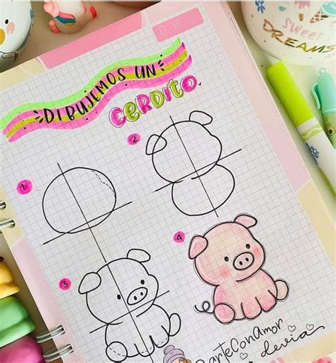 An Open Notebook With Drawings On It Next To Some Pens And Other Items