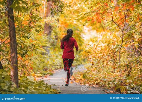 Run Woman Jogging In Outdoor Fall Autumn Foliage Nature Background In