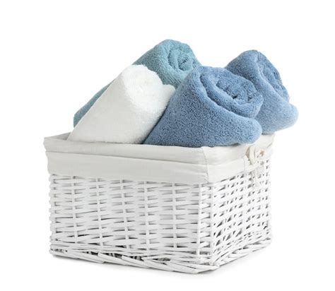 Premium Photo Basket With Rolled Towels Isolated On White