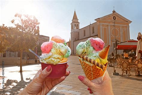 Couple With Beautiful Bright Sweet Ice Cream Of Different Flavors In