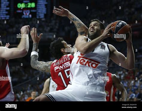 Real S Felipe Reyes Right Goes For The Basket Next To Olympiacos