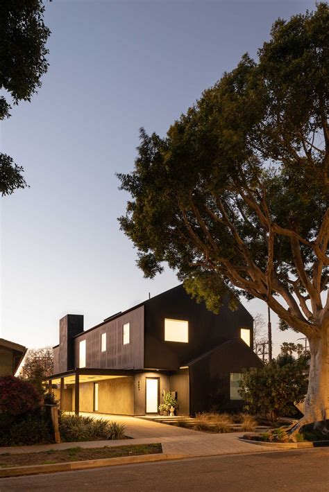 The Black Exterior Of This Barn-Inspired Home Is Contrasted With A White Interior - Design Skill ...