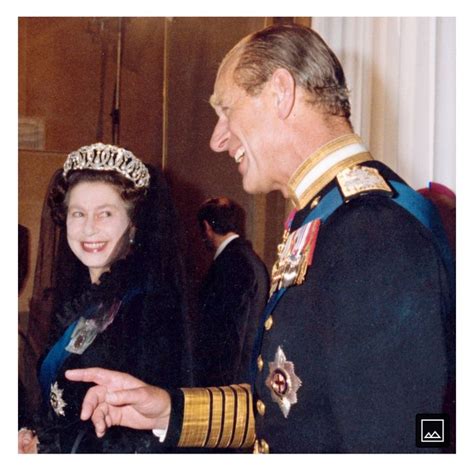 A Man In Uniform Talking To A Woman Wearing A Tiara