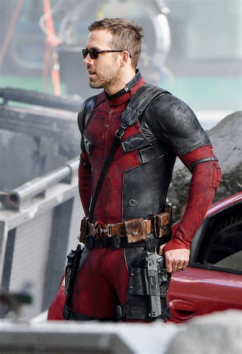 Ryan Reynolds in his Deadpool costume and a pair of sunglasses casually ...