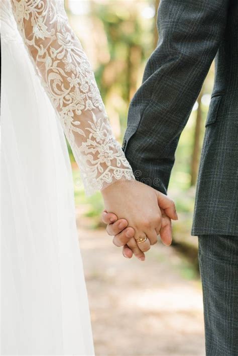 Wedding Couple Lovers Bride And Groom Holding Hands Go Stock Photo