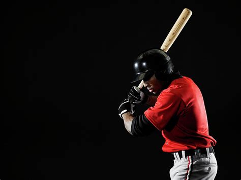 Young Man Holding Baseball Bat Looking By Thomas Barwick