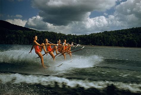 A Womens Water Ski Team Lifts Skis While Being Towed At 23 Mph On