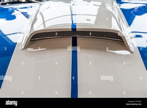 Closeup On Hood Of A Blue And White Sport Car Stock Photo Alamy