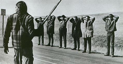 A Member Of The American Indian Movement Guards Four Government Officials And Two Locals During