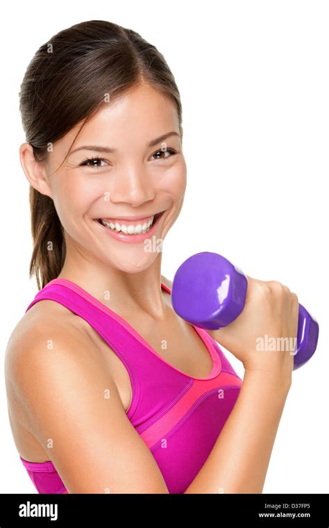 Portrait Of Happy Mixed Caucasian Asian Fit Woman Lifting Dumbbells