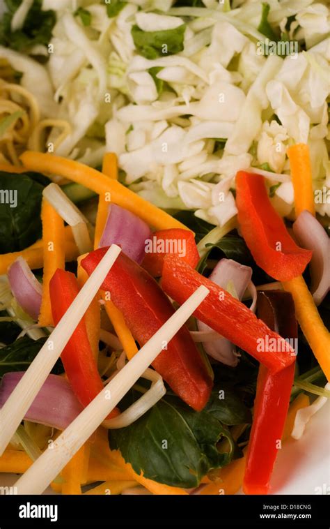 Chop Sticks And Raw Thai Food Stir Fry Stock Photo Alamy