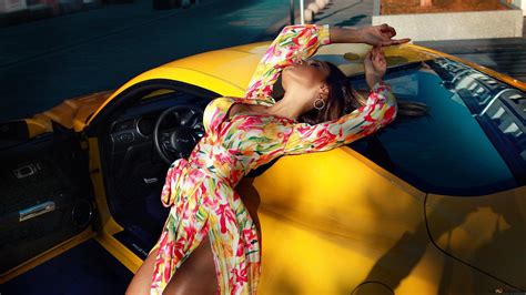 Model wearing an artistic long dress posing in yellow car 2K wallpaper ...