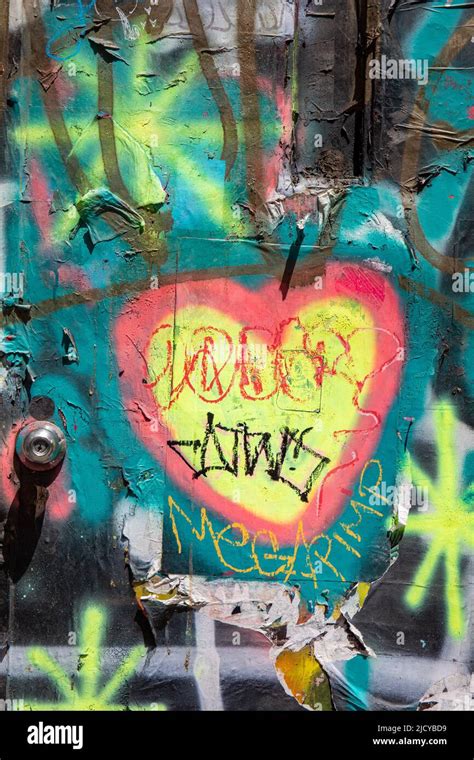 Street Art Yellow Heart Graffiti On Exterior Door In Lower East Side District Of Manhattan New