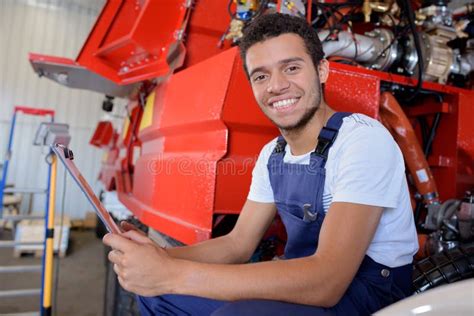 Factory Worker Operating Machine Units At Modern Factory Stock Image