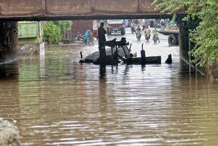 Pakistani People Wade Through Flooded Road Editorial Stock Photo